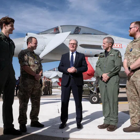 British Prime Minister Keir Starmer (centre) speaking with British armed forces personnel at the Tusas airbase in Ankara, during a visit to Turkey on Oct 27.
