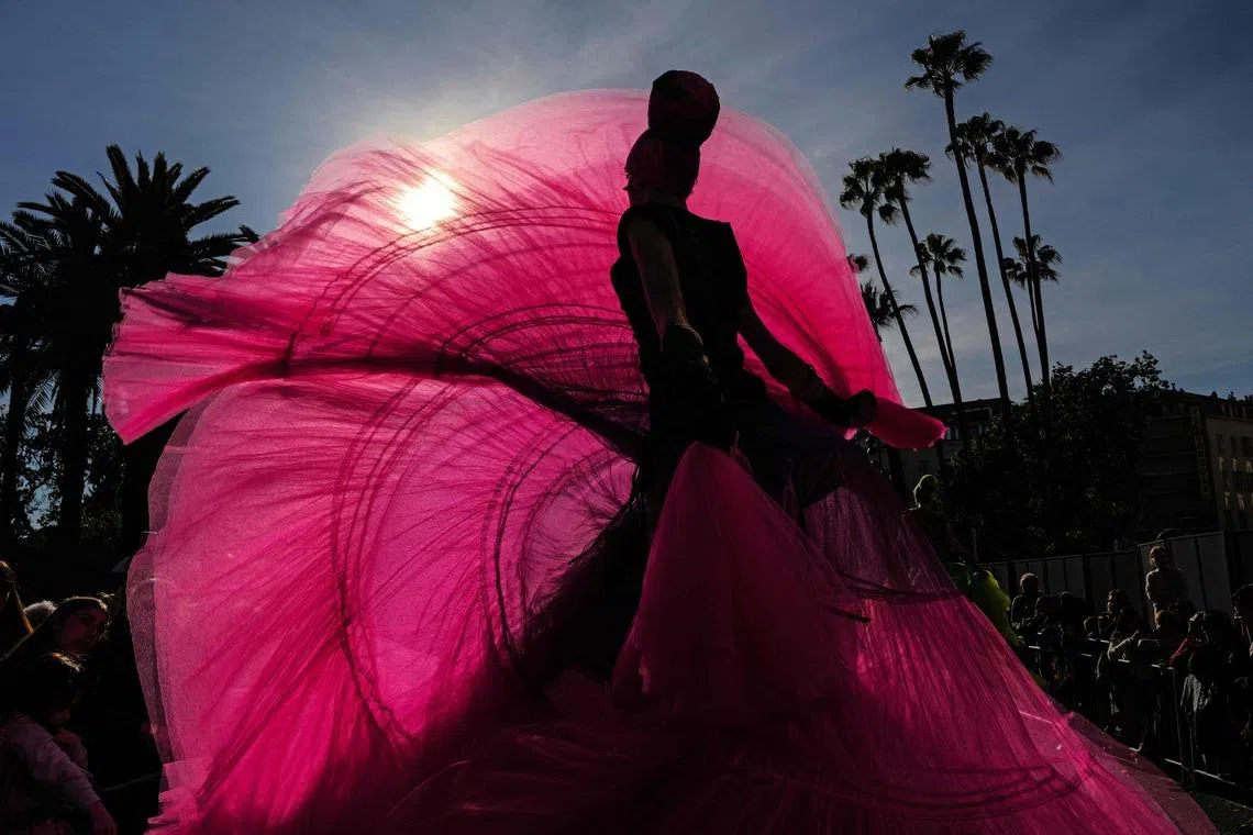 An artist performing during the Flower Parade, as part the 141st edition of the Nice Carnival in the French Riviera City of Nice, on Feb 18, 2026. 