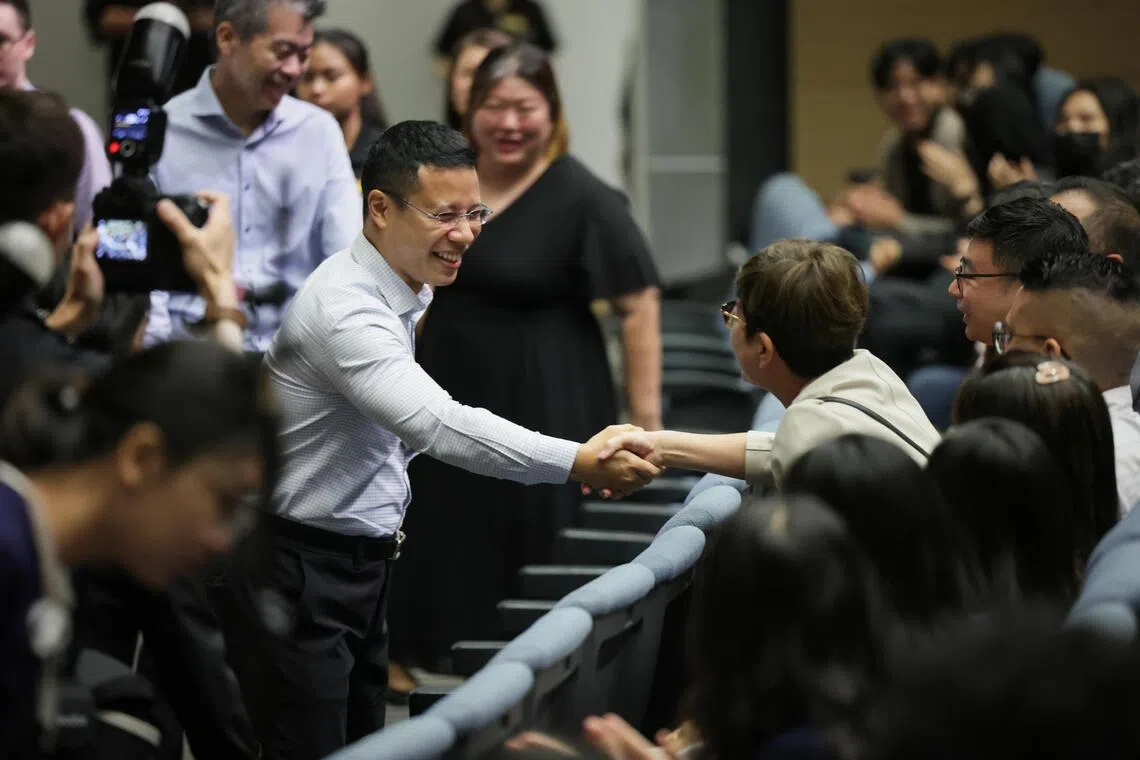 Mr Desmond Lee, Minister for Education in a handshake with a attendee at the Polytechnic Forum 2025 held in Singapore Polytechnic Convention Centre on Sep 15, 2025.