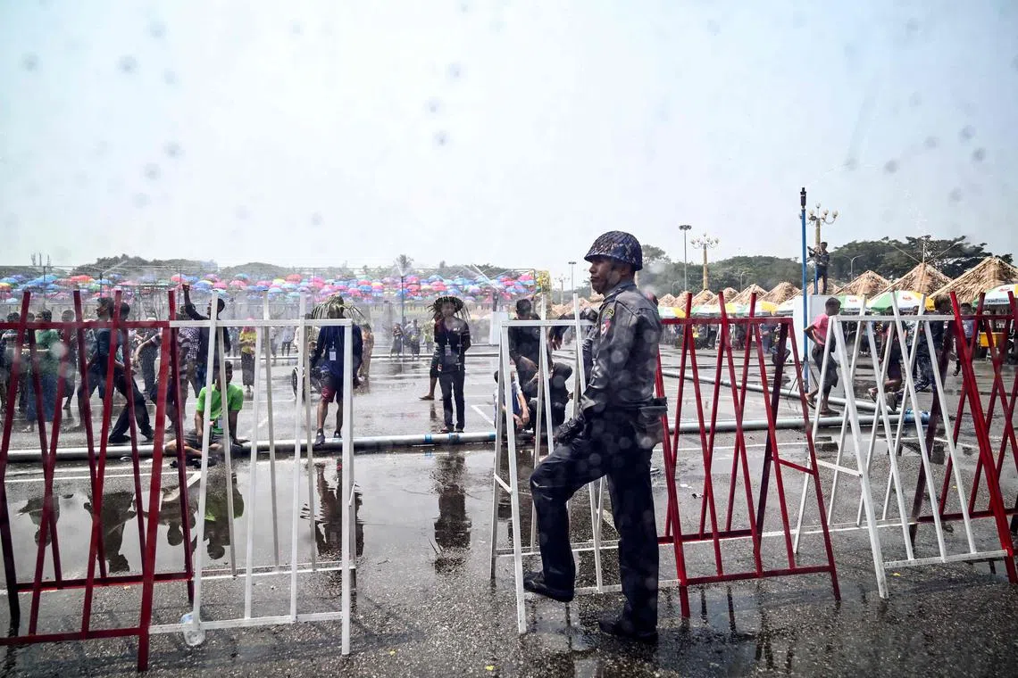 A police officer stands guard during Myanmar's New Year water festival in Yangon in April.