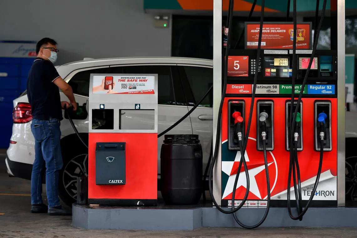 A motorist pumping petrol at Caltex Petrol Service Station at Beach Road on February 16, 2021.