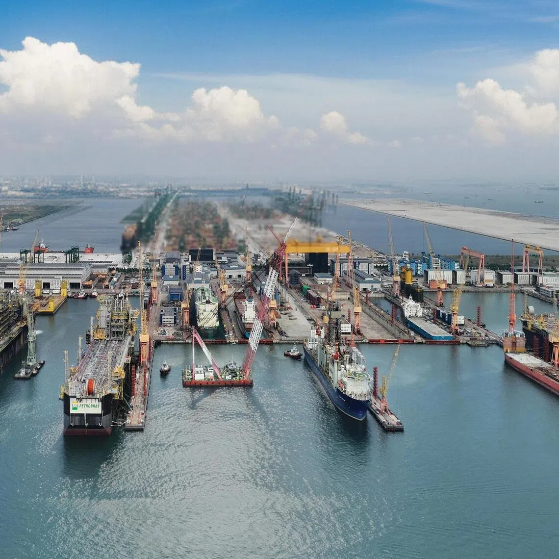 Three floating production storage and offloading vessels (FPSOs) at Seatrium Tuas Boulevard Yard.