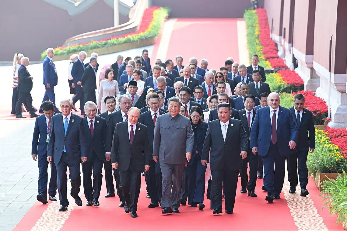 Chinese President Xi Jinping (front centre), Russian President Vladimir Putin (front left), North Korean leader Kim Jong Un (front R) and foreign leaders walking to Tian'anmen Rostruma ahead of a military parade marking the 80th anniversary of victory over Japan and the end of World War II, in Beijing’s Tiananmen Square, China, on Sept 3, 2025.  
