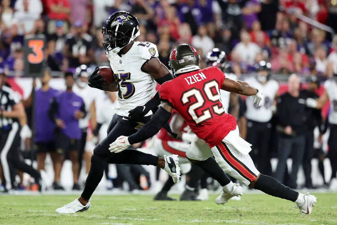 FILE PHOTO: Oct 21, 2024; Tampa, Florida, USA; Baltimore Ravens wide receiver Nelson Agholor (15) runs with the ball as Tampa Bay Buccaneers safety Christian Izien (29) defends during the first half at Raymond James Stadium. Mandatory Credit: Kim Klement Neitzel-Imagn Images/File photo
