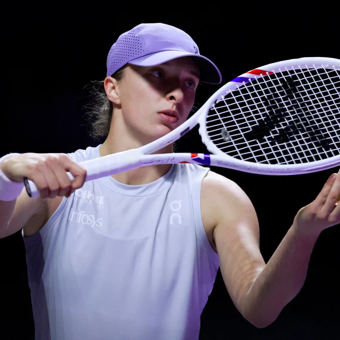 Tennis - WTA Finals - Riyadh - King Saud University Indoor Arena, Riyadh, Saudi Arabia - November 5, 2025 Poland's Iga Swiatek in action during her group stage match against Amanda Anisimova of the U.S. REUTERS/Stephanie Lecocq