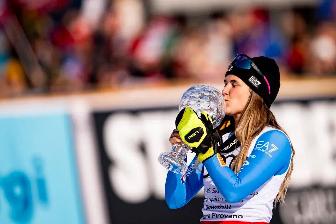 Laura Pirovano of Italy celebrates with the women's downhill overall winner's crystal globe trophy at the FIS Alpine Skiing World Cup Finals in Kvitfjell, Norway on March 21, 2026.