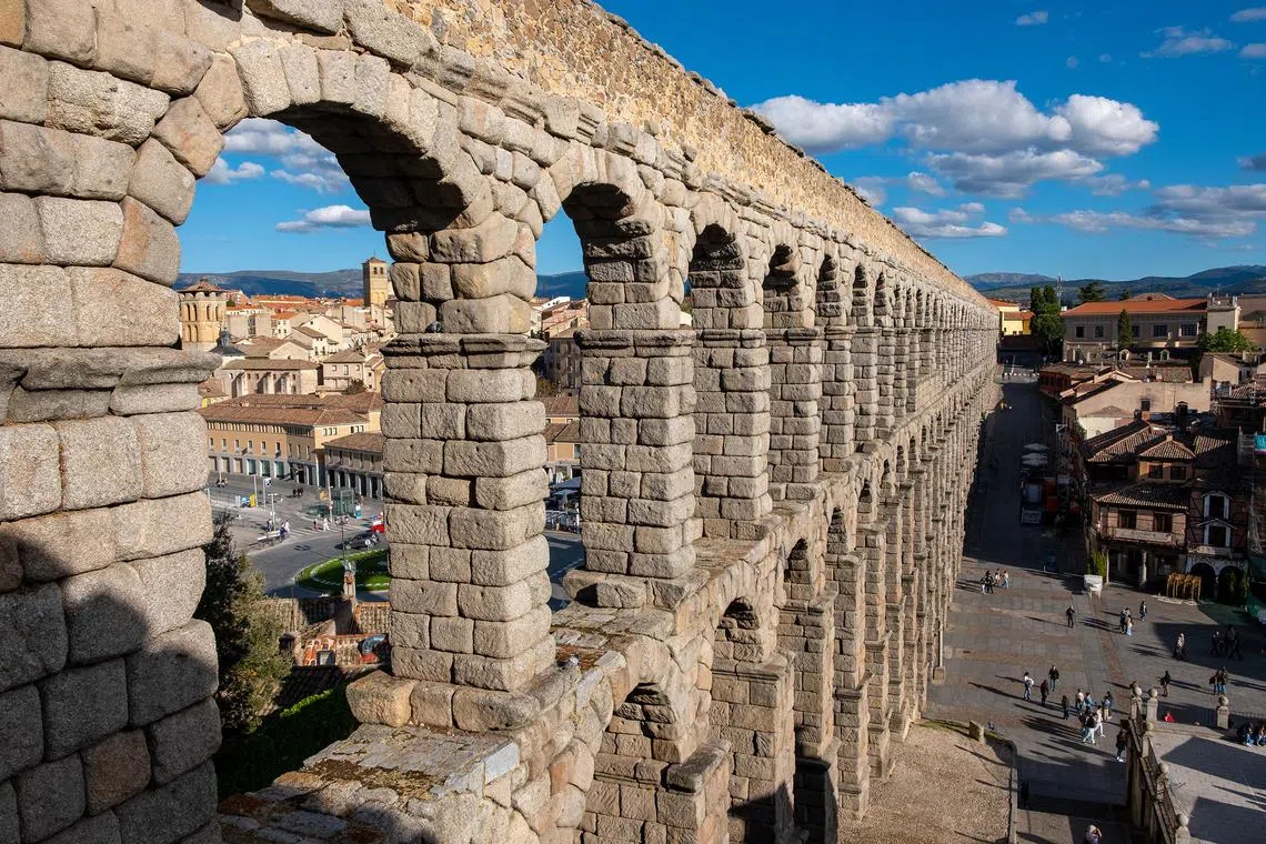Aqueduct in Segovia, with Meson de Candido restaurant at bottom right.