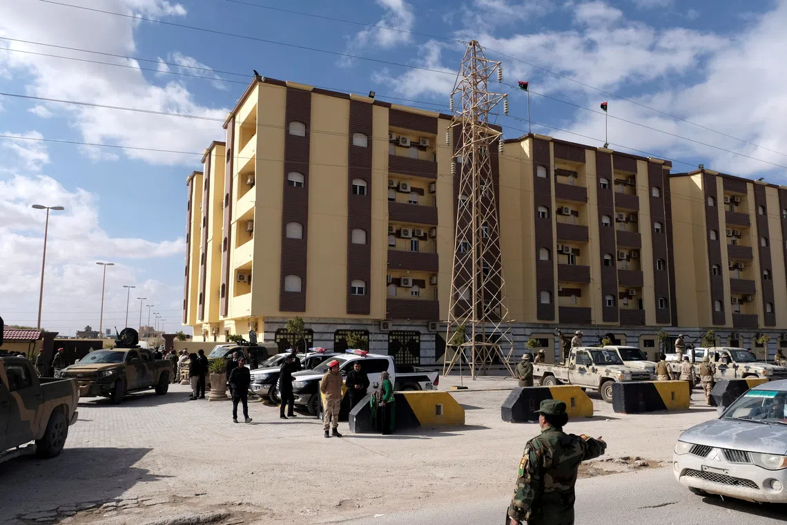 FILE PHOTO: Security forces stand guard outside the Parliament building, in Tobruk, Libya, February 10, 2022 REUTERS/Esam Omran Al-Fetori/File Photo