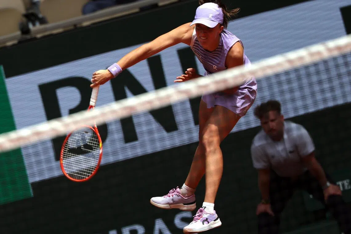 Iga Swiatek of Poland in action during her third round match against compatriot Magda Linette.