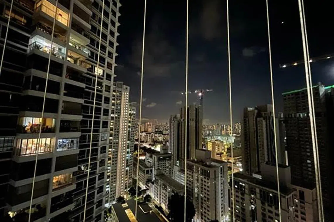 View of city lights from a 4-room, 1,022 sq ft HDB flat in Boon Keng Road, that is selling for $1.08 million. It is listed by ERA Realty Network director (associate division) Chernys Lim. 