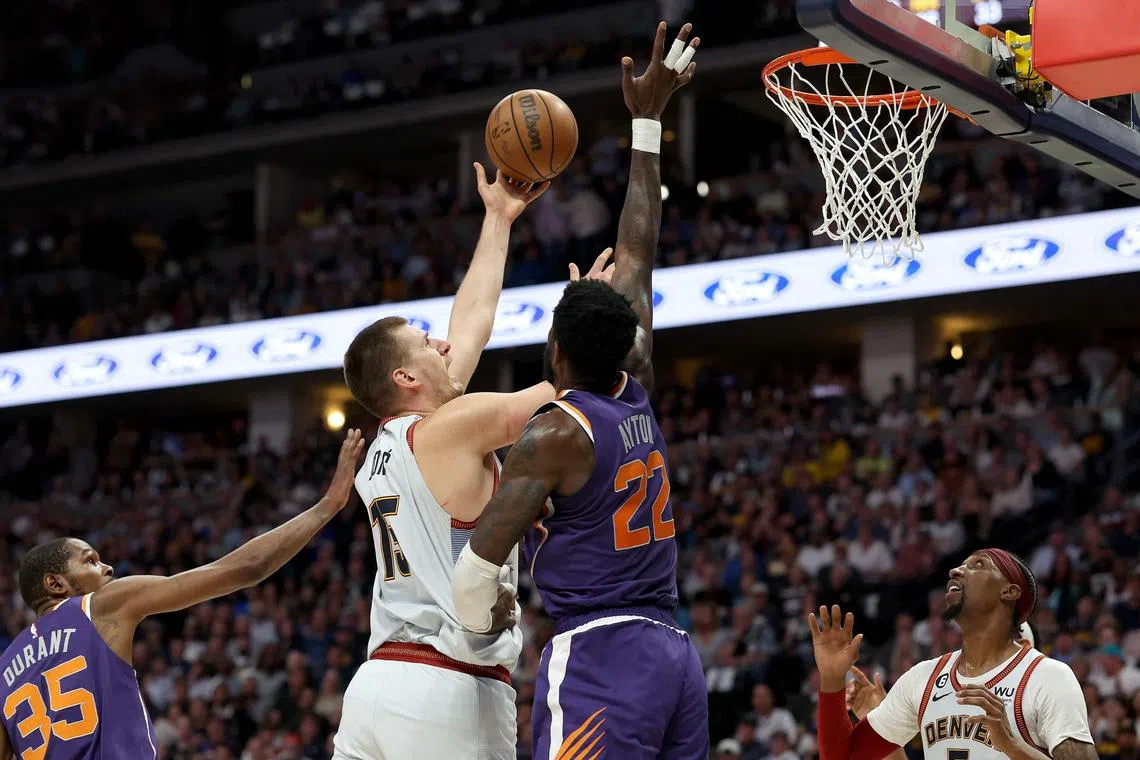Nikola Jokic of the Denver Nuggets puts up a shot against Deandre Ayton of the Phoenix Suns during Game 5 of their NBA play-offs.