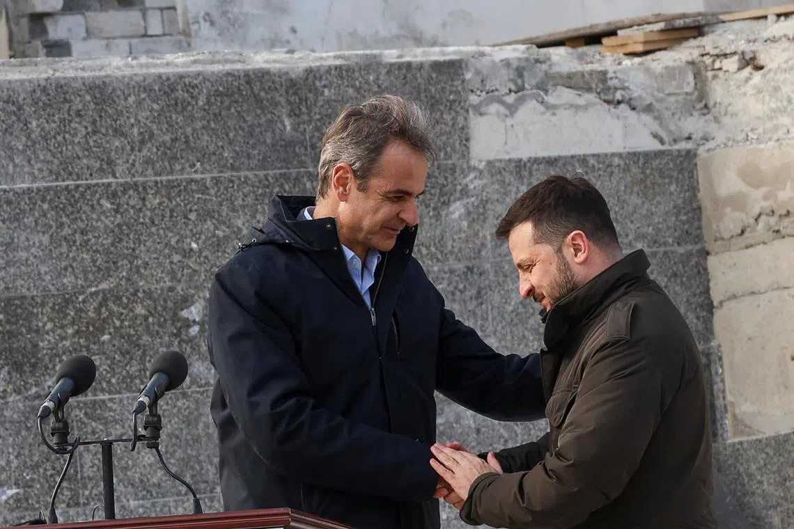 Ukraine's President Volodymyr Zelenskiy and Greek Prime Minister Kyriakos Mitsotakis shake hands after a joint press conference, amid Russia's attack on Ukraine, in Odesa, Ukraine March 6, 2024. REUTERS/Stringer