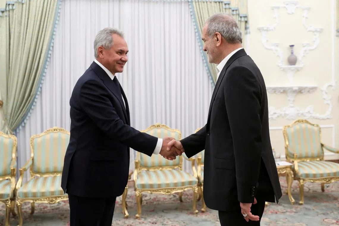 Iran's President Masoud Pezeshkian (right) meets with Russian Security Council's Secretary Sergei Shoigu in Tehran, Iran, on Aug 5, 2024.