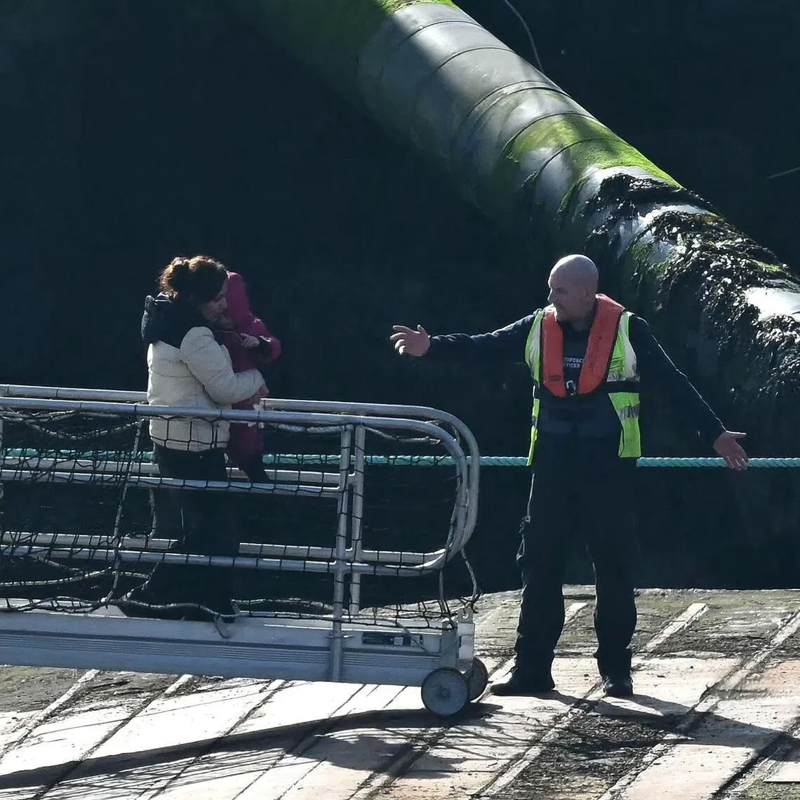 Migrants including children picked up at sea while attempting to cross the English Channel, are escorted off a UK Border Force boat upon arrival in Ramsgate, South-east England, on Feb 25.