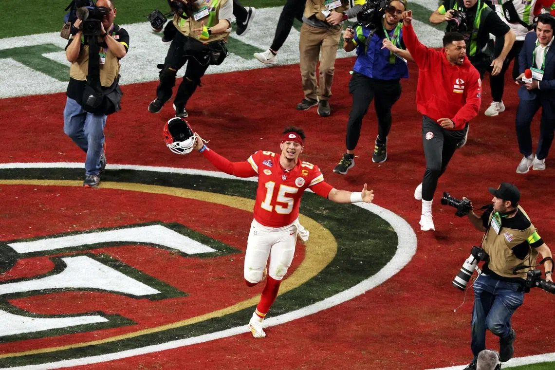 In pursuit of the hero: Photographers chase the Kansas City Chiefs' Patrick Mahomes as he celebrates after winning Super Bowl LVIII.