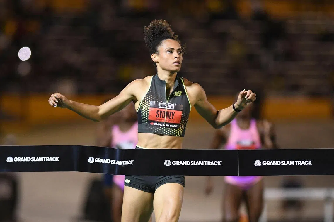 The United States' Sydney McLaughlin-Levrone of team New Balance crossing the finishing line in first place in the women's 400m long hurdles during the Grand Slam Track competition at the National Stadium in Kingston, Jamaica on April 4, 2025.