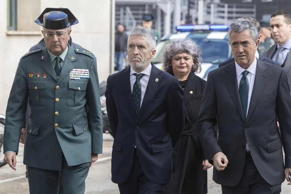 Interior Minister Fernando Grande-Marlaska (second from left) visits the civil guard headquarters in Cadiz, Spain, after two officers died trying to apprehend drug traffickers.