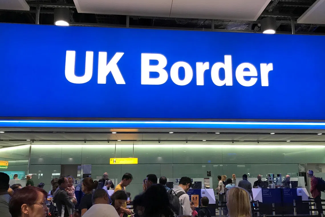 Signage is seen at the UK border control point at the arrivals area of Heathrow Airport, London, September 3, 2018. Picture taken on September 3. REUTERS/Toby Melville