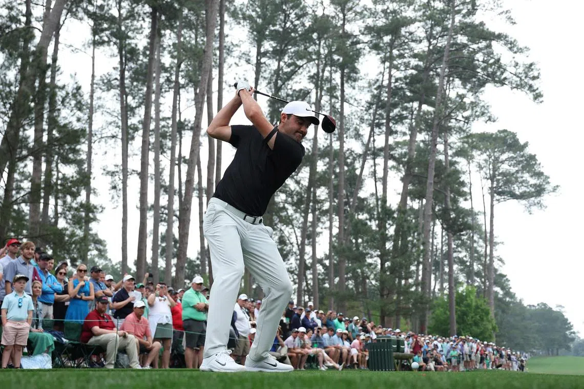 Scottie Scheffler playing his shot from the 17th tee during a practice round ahead of the Masters  at Augusta National Golf Club.