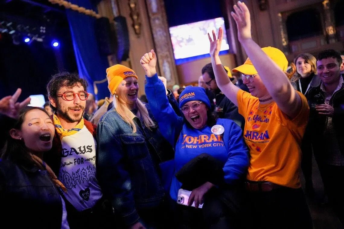 Attendees during an election night event with Zohran Mamdani, New York City mayoral candidate, not pictured, at The Brooklyn Paramount Theater in the Brooklyn borough of New York, US, on Tuesday, Nov. 4, 2025. New Yorkers are flocking to the polls at the fastest pace in decades, with 1,748,698 votes recorded by 6 p.m. Tuesday, according to the city's Board of Elections. Photographer: Adam Gray/Bloomberg