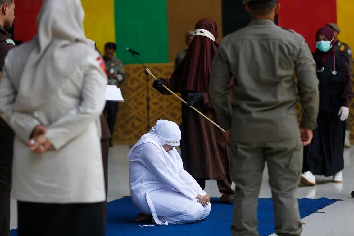 The two women and two men received 100 lashes each in front of dozens of onlookers in a public park in the provincial capital Banda Aceh.