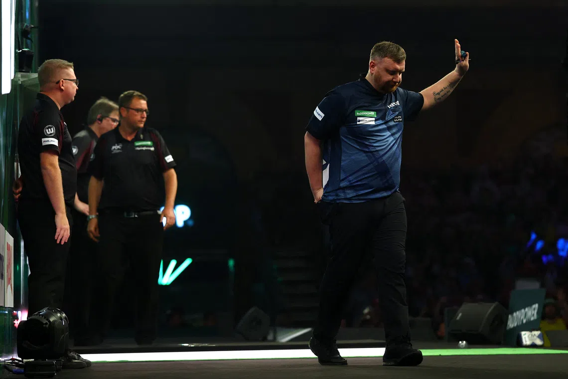 Darts-Menzies apologises for punching table at World Championship