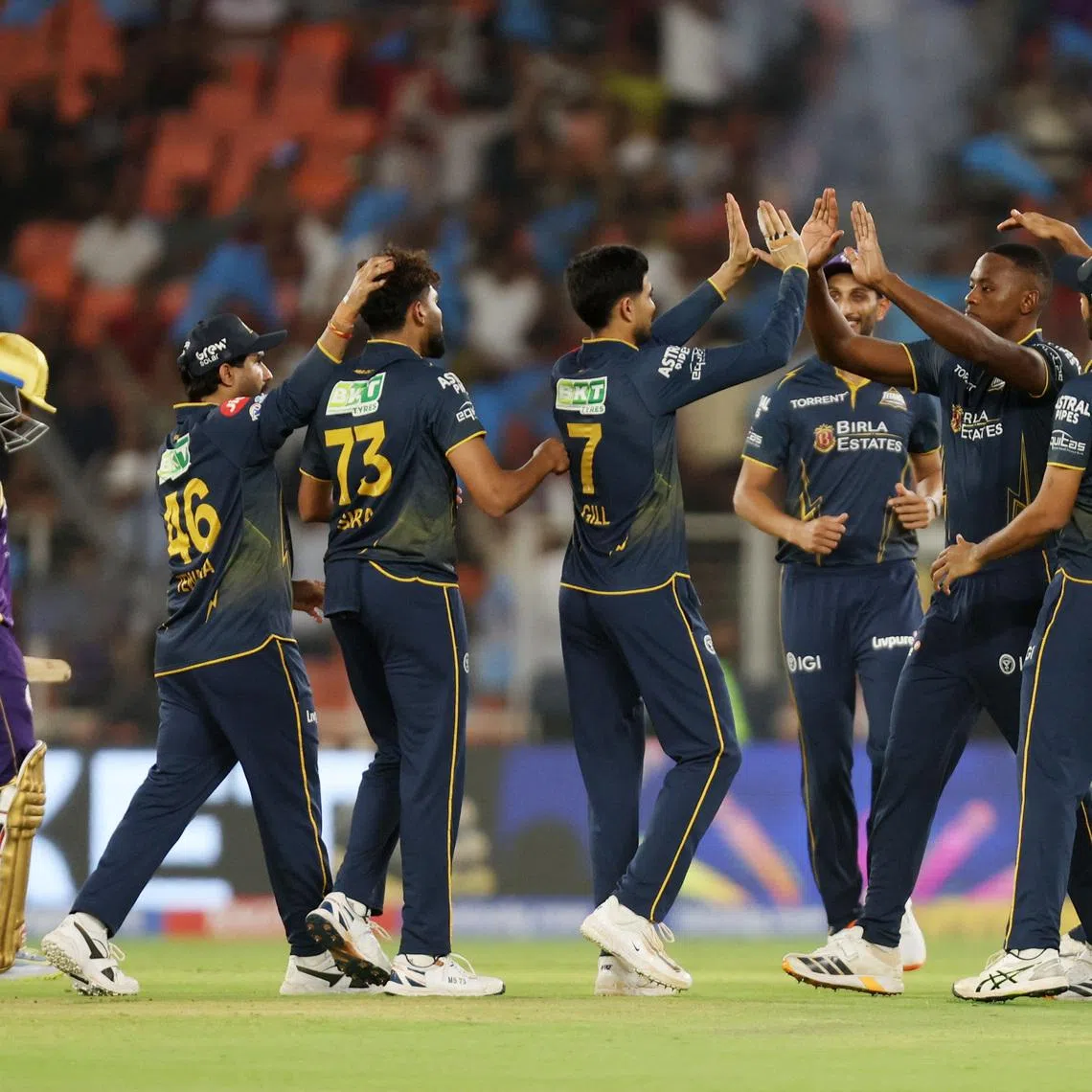 Cricket - Indian Premier League - IPL - Gujarat Titans v Kolkata Knight Riders - Narendra Modi Stadium, Ahmedabad, India - April 17, 2026 Gujarat Titans's Kagiso Rabada celebrates with teammates taking the wicket of  Kolkata Knight Riders' Angkrish Raghuvanshi REUTERS/Amit Dave
