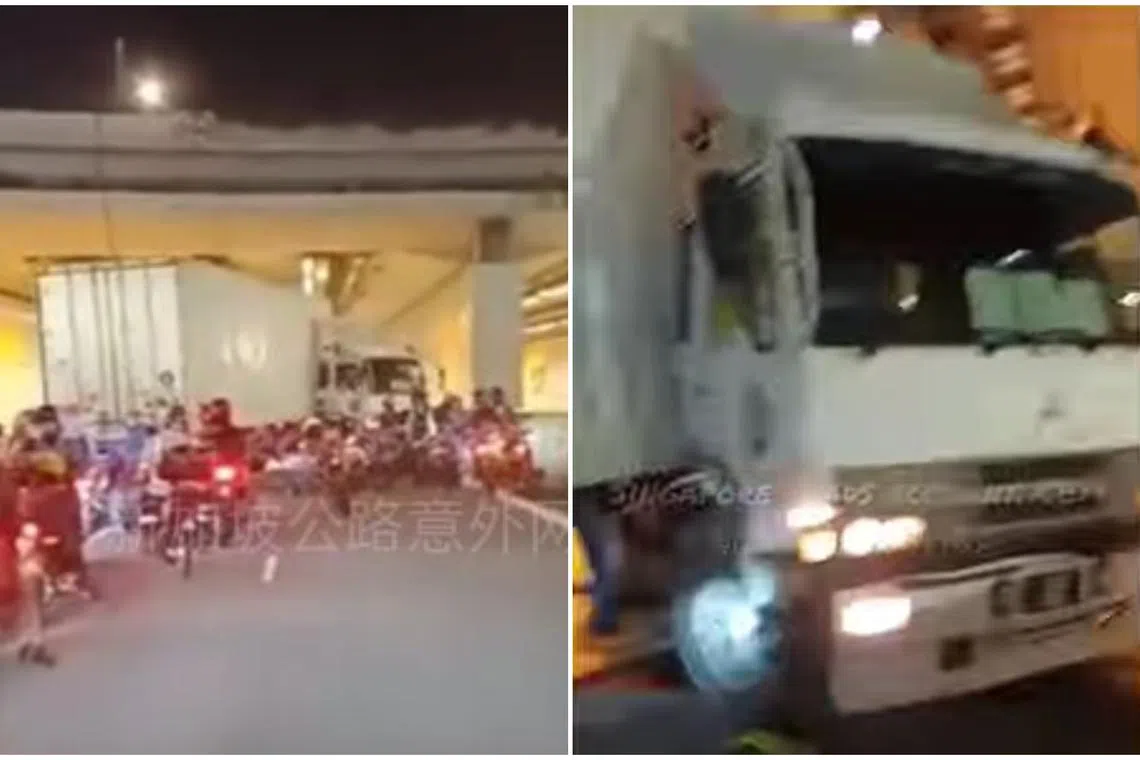 The trailer is occupying the middle lane in the direction of traffic, while the connected truck is positioned diagonally against traffic flow in the rightmost lane.