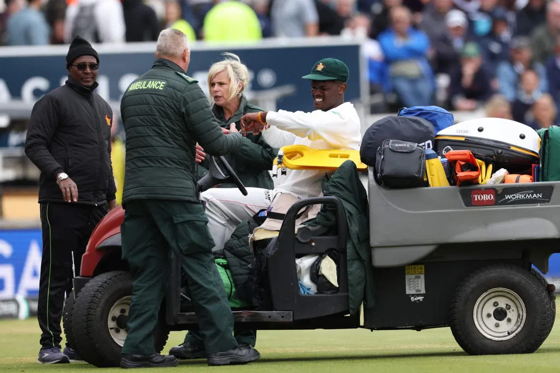 Zimbabwe's Richard Ngarava leaves the field on a cart after a back injury while fielding on the first day of the four-day Test cricket match against England at Trent Bridge in Nottingham on May 22, 2025.