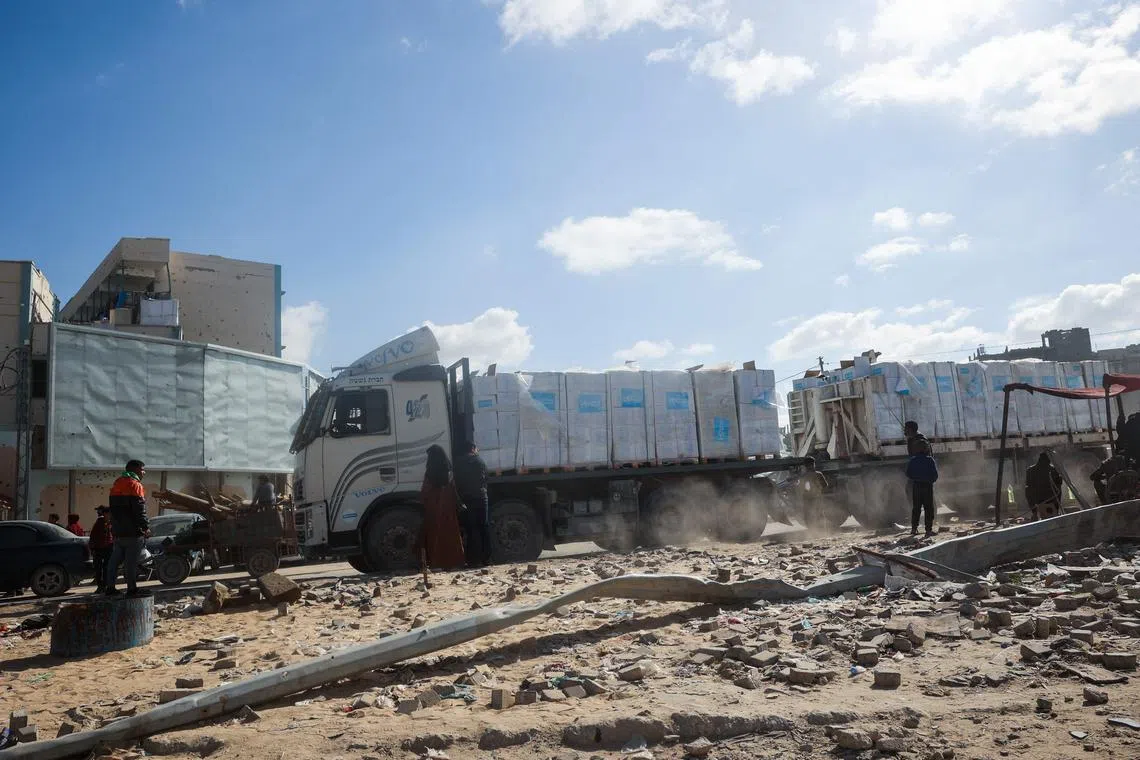 A truck loaded with aid drives by in Gaza's southern city of Rafah on Jan 20.