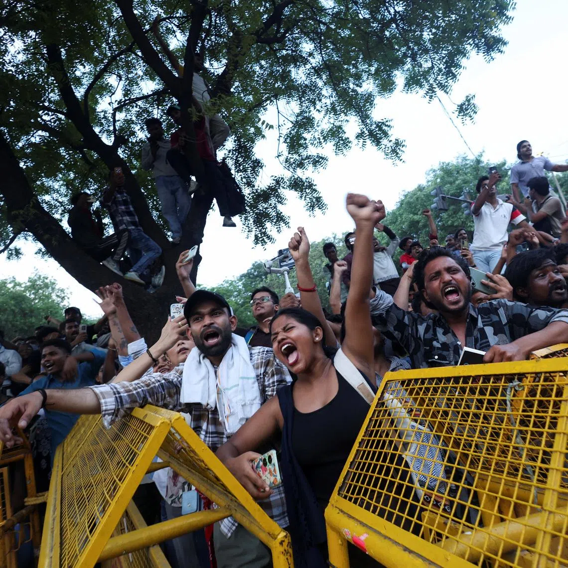 Cockroach Janta Party (CJP) supporters celebrate after the resignation of Education Minister Dharmendra Pradhan over National Eligibility cum Entrance Test (NEET) examination paper leaks, at Jantar Mantar in New Delhi, India, July 25, 2026. REUTERS/Priyanshu Singh