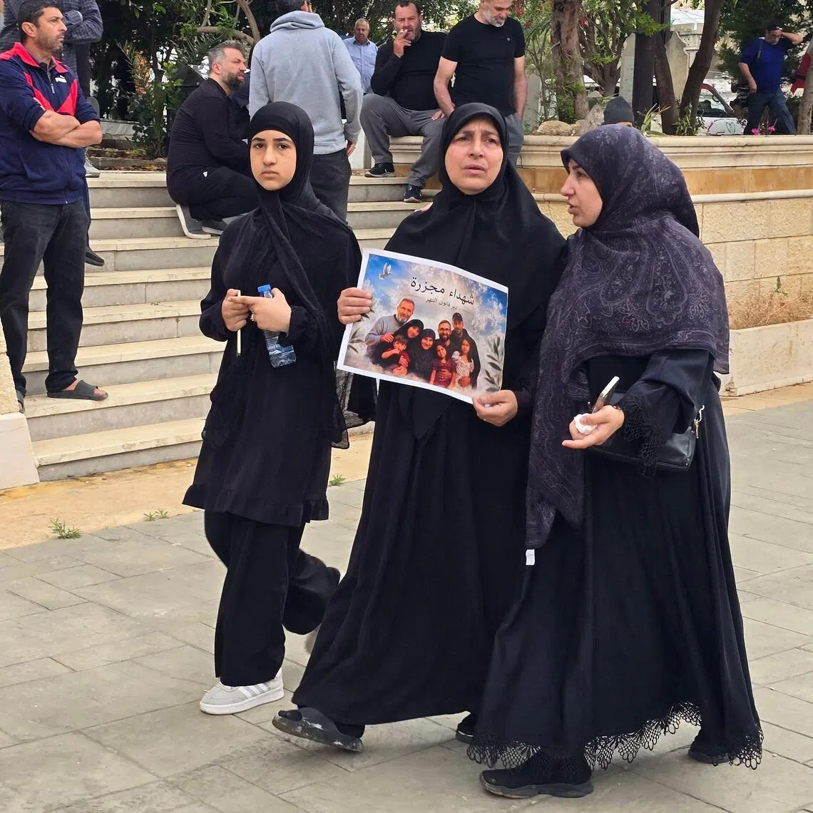 Relatives attend the funeral of victims killed in the Israeli strike on the southern village of Deïr Qanoun En-Nahr.