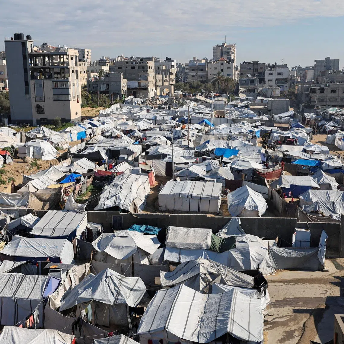 Palestinians displaced during the two-year Israeli offensive, shelter at a tent camp in Gaza City, March 1, 2026. REUTERS/Dawoud Abu Alkas