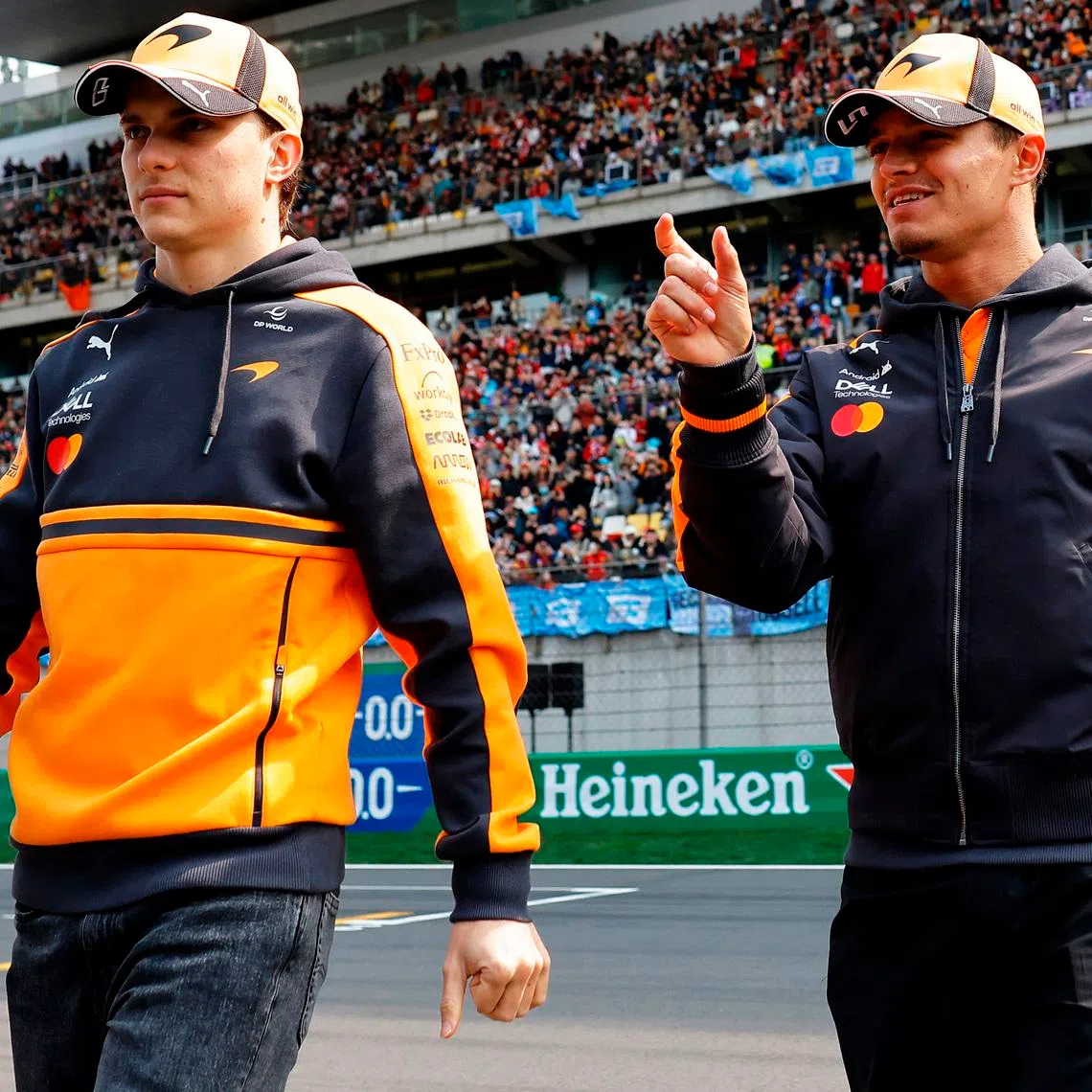 Formula One F1 - Chinese Grand Prix - Shanghai International Circuit, Shanghai, China - March 15, 2026 McLaren's Oscar Piastri and McLaren's Lando Norris during the drivers parade before the race REUTERS/Maxim Shemetov