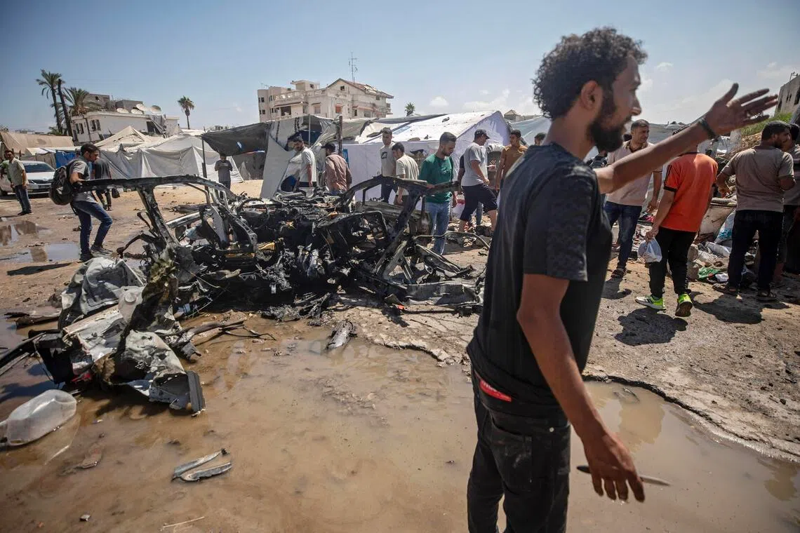 Locals gathering at the site of an Israeli airstrike in Gaza City on Sept 1.