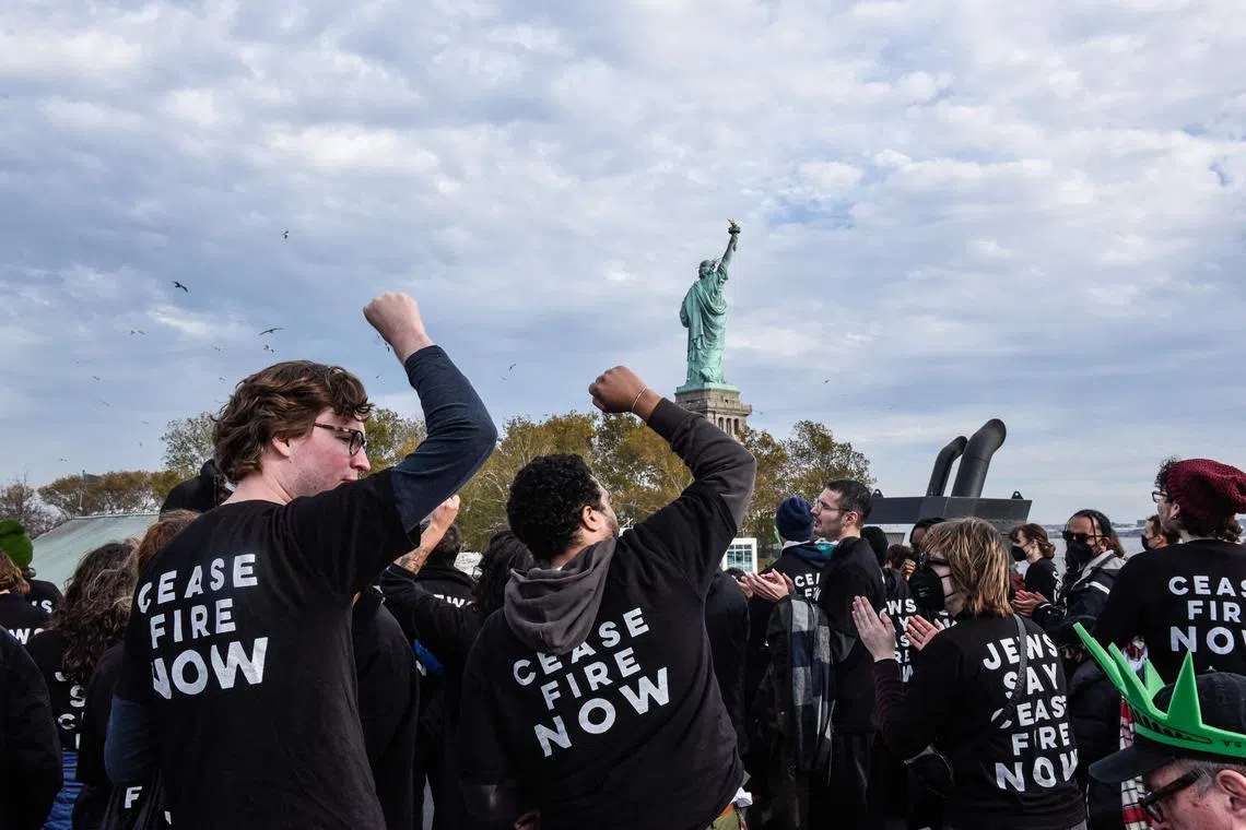 Activists from Jewish Voice for Peace return to the ferry after occupying the pedestal of the Statue of Liberty on Monday.  