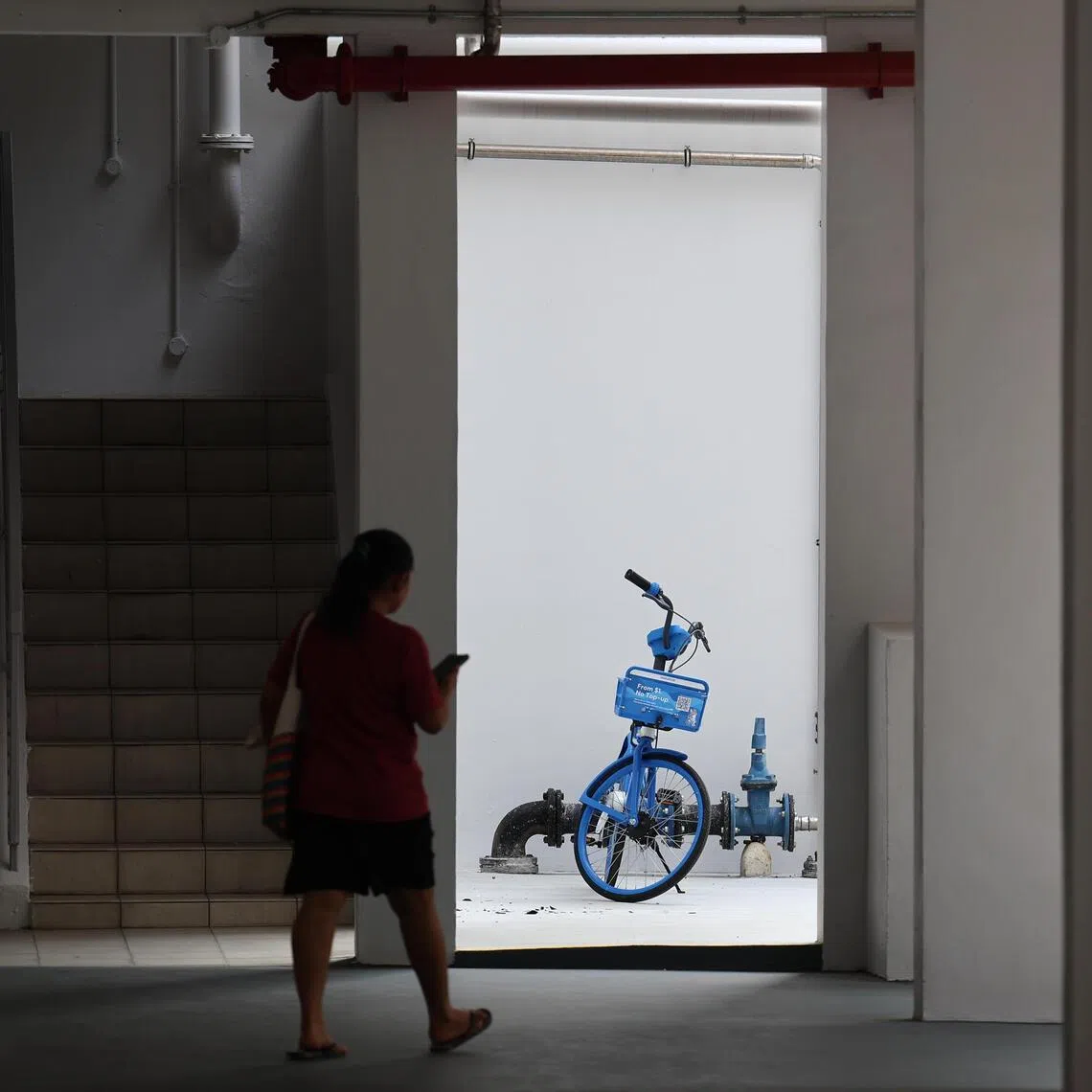 A HelloRide bicycle parked outside a designated parking zone at Simei.