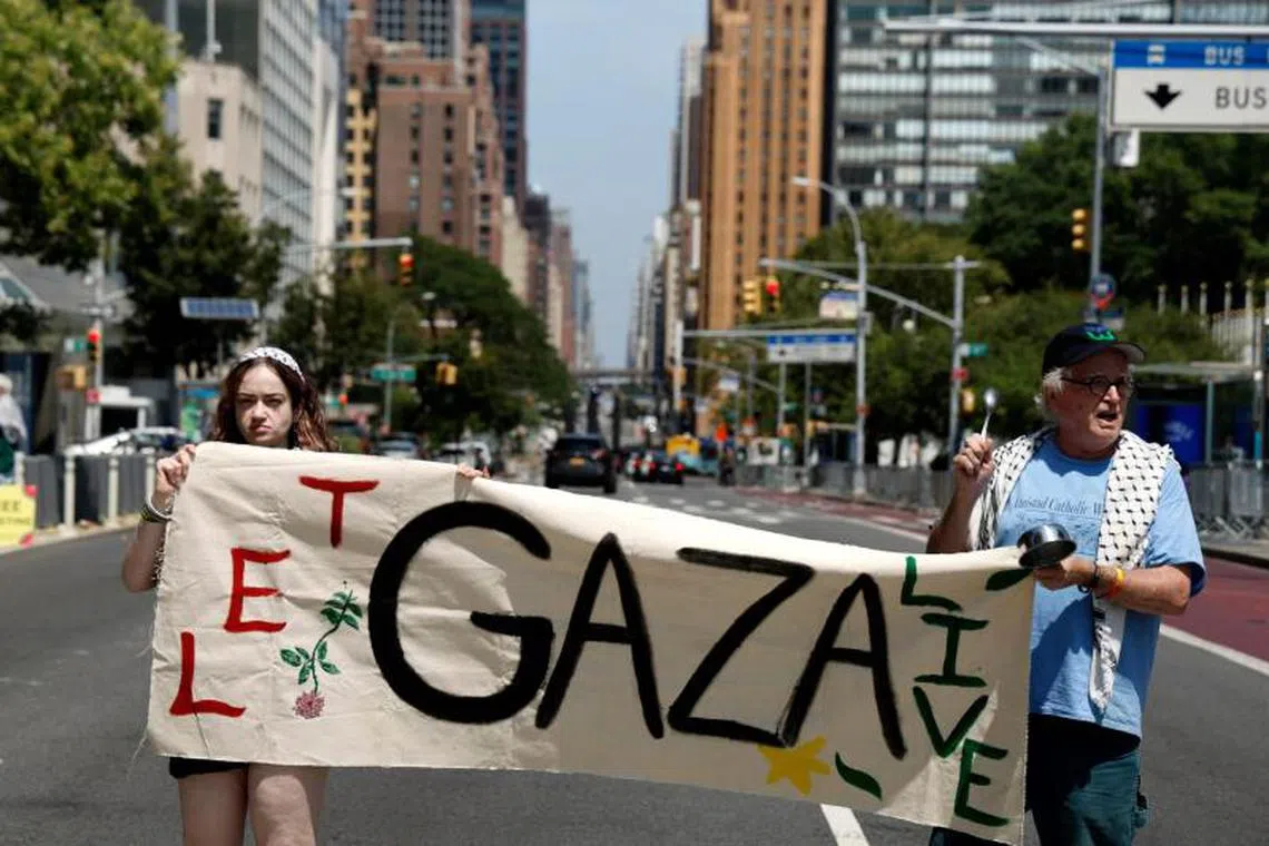 Protestors demonstrate outside UN headquarters in New York as the UN Security Council holds an emergency meeting on the situation in Gaza on Aug 10.