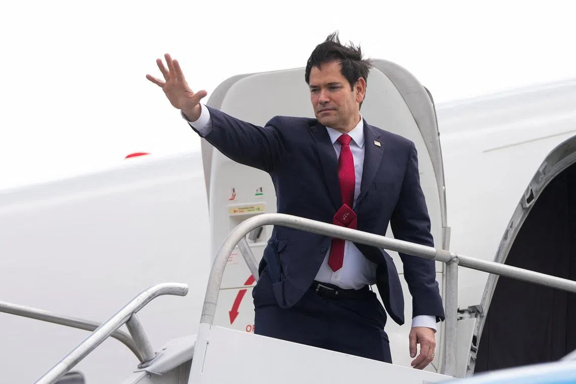 U.S. Secretary of State Marco Rubio waves as he boards a plane at Juan Santamaria International Airport near San Jose, Costa Rica, Feb. 4, 2025.     Mark Schiefelbein/Pool via REUTERS