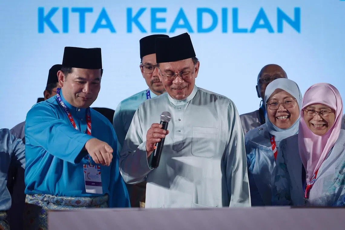Malaysia's former economy minister Rafizi Ramli (left) and nine other MPs aligned to him broke ranks with colleagues in PM Anwar Ibrahim's government over an attempt create a new office of Public Prosecutor on March 2.