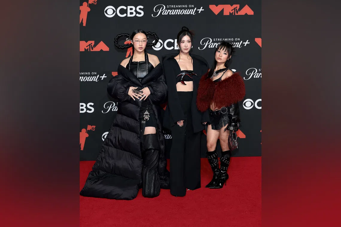 (From left) Audrey Nuna, Ejae and Rei Ami provide the singing voices for fictional girl group Huntrix in the film KPop Demon Hunters.