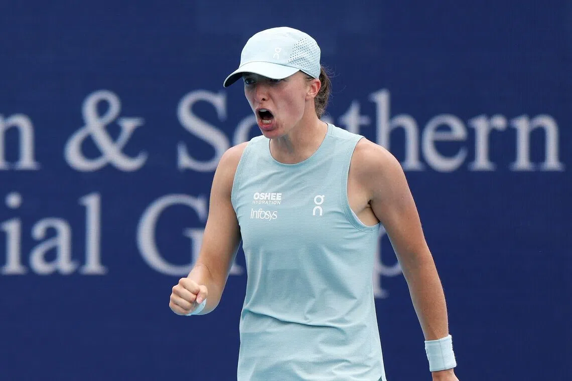 Iga Swiatek celebrates after defeating Maria Sakkari at Cincinnati.
