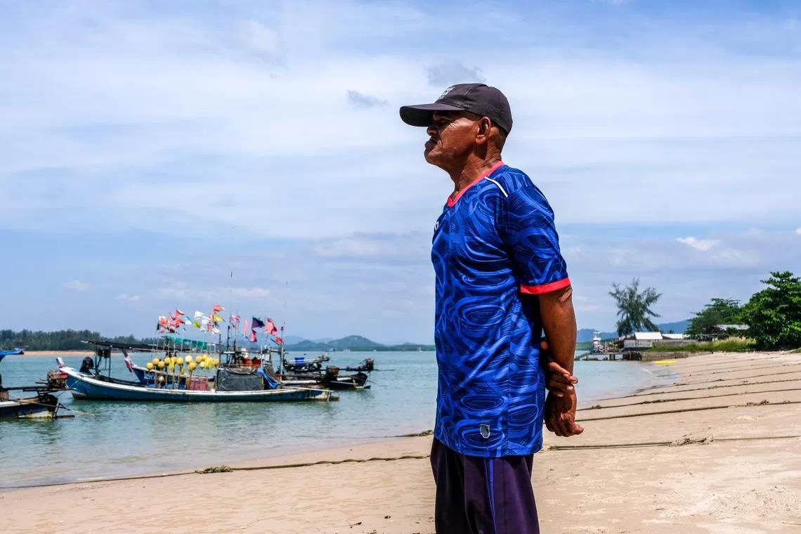 FILE PHOTO: Banlue Choosin, a 2004 Indian Ocean Tsunami survivor-turned-wave watcher, looks on at a seashore in Ban Nam Khem, a southern fishing village destroyed by the wave, ahead of the 20th anniversary of the Indian Ocean tsunami in Phang Nga province of southern Thailand, December 2, 2024. REUTERS/Juarawee Kittisilpa/File Photo