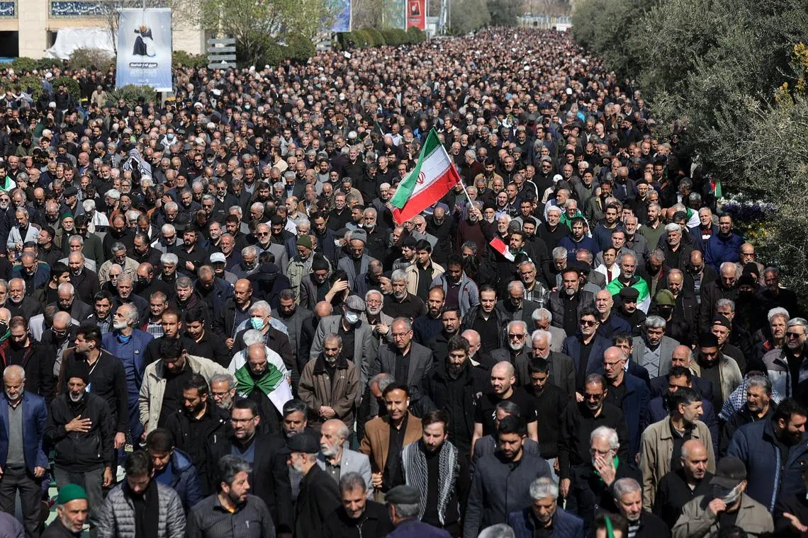 A man waves an Iranian flag, as Muslims attend Friday prayer, amid the U.S.-Israeli conflict with Iran, in Tehran, Iran, March 6, 2026. Majid Asgaripour/WANA (West Asia News Agency) via REUTERS