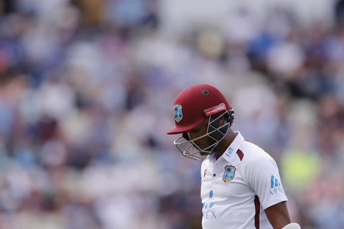 FILE PHOTO: Cricket - Third Test - England v West Indies - Edgbaston Cricket Ground, Birmingham, Britain - July 27, 2024 West Indies' Kraigg Brathwaite walks back to the pavilion after losing his wicket, bowled out by England's Chris Woakes Action Images via Reuters/Andrew Couldridge/File photo