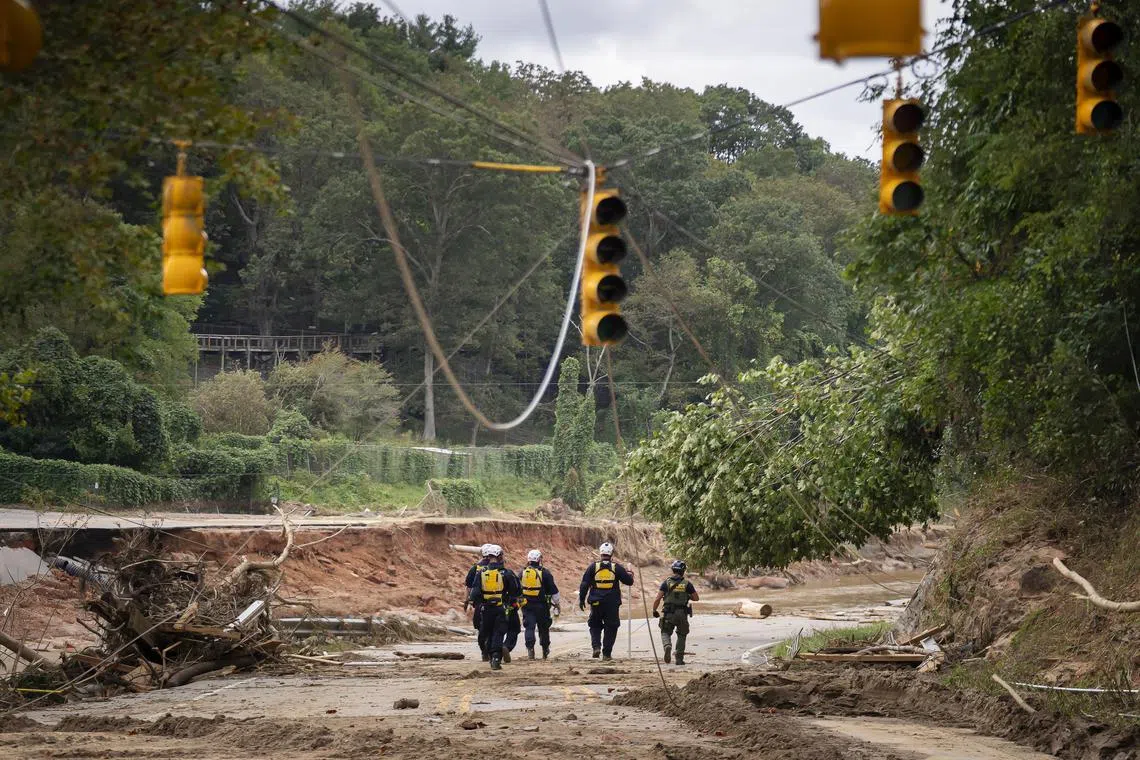 A search and rescue crew in Asheville, N.C., on Monday, Sept. 30, 2024. The remnants of Hurricane Helene unleashed catastrophic floods and mudslides in western North Carolina that destroyed or decimated many communities. (Nicole Craine/The New York Times)