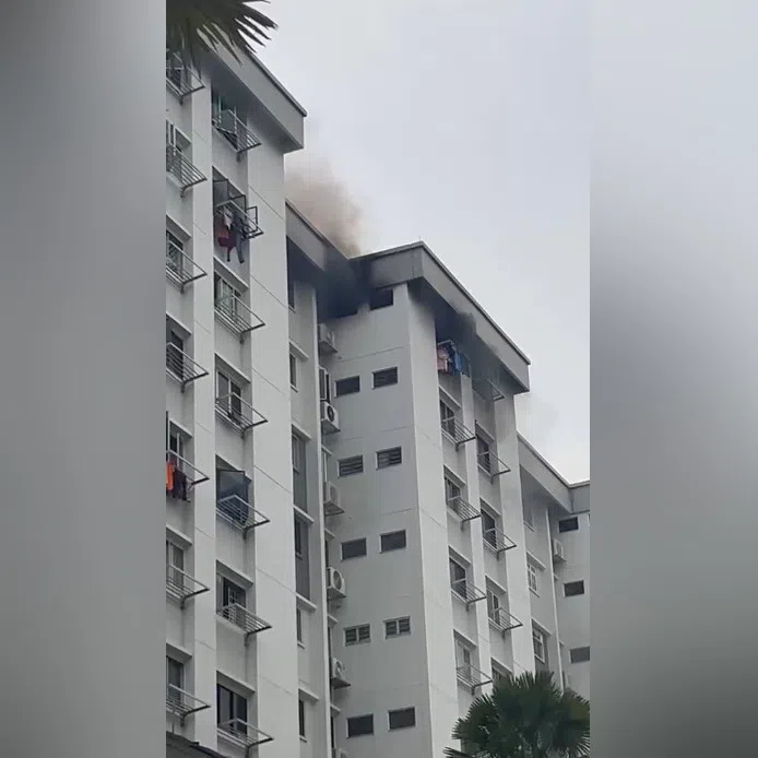 Black smoke was emitting from a unit on the 12th floor when SCDF arrived.