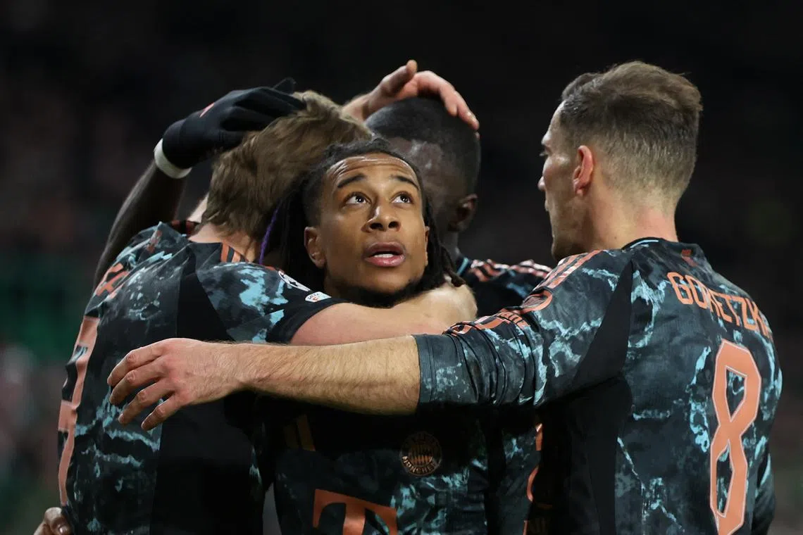 Soccer Football - Champions League - Knockout Phase Playoff - First Leg - Celtic v Bayern Munich - Celtic Park, Glasgow, Scotland, Britain - February 12, 2025 Bayern Munich's Michael Olise celebrates scoring their first goal with teammates REUTERS/Russell Cheyne