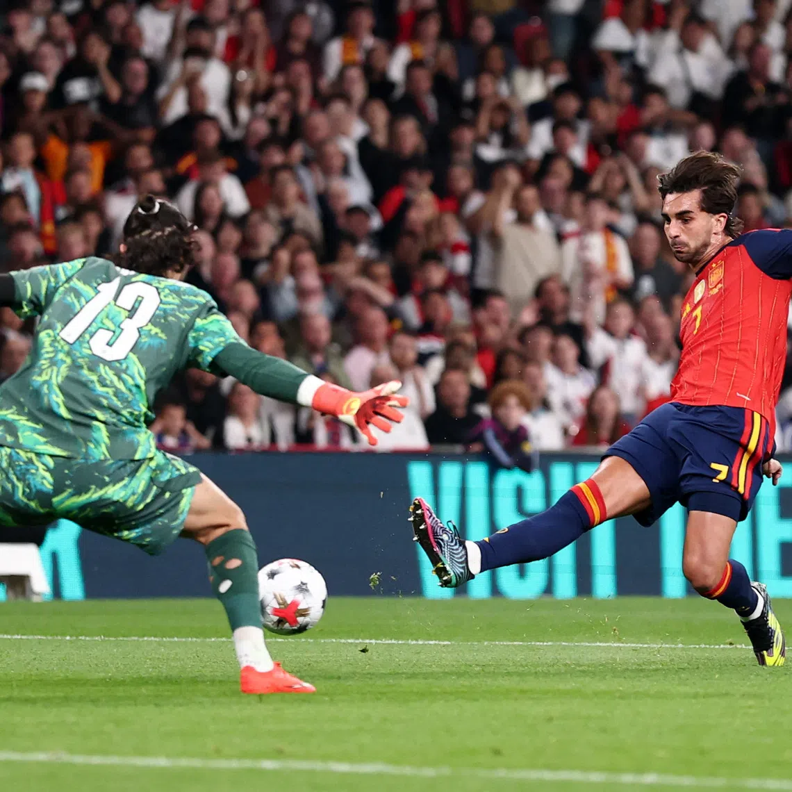 Soccer Football - Nations League - Group A3 - England v Spain - Wembley Stadium, London, Britain - September 26, 2026 England's James Trafford saves the shot from Spain's Ferran Torres REUTERS/David Klein