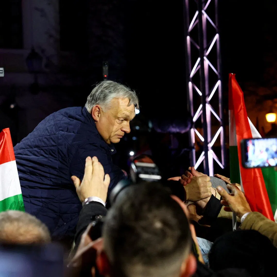 Hungarian Prime Minister Viktor Orban greets the supporters during an election campaign rally in Gyor, Hungary, March 27, 2026. REUTERS/Bernadett Szabo